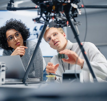 students working on a drone