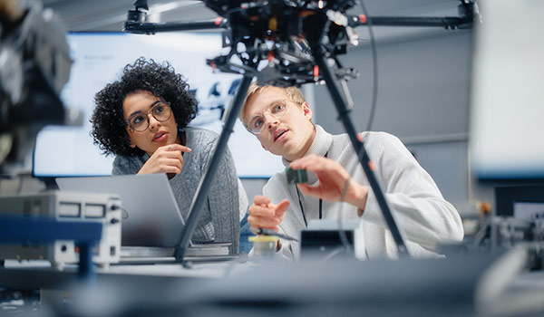 students working on a drone
